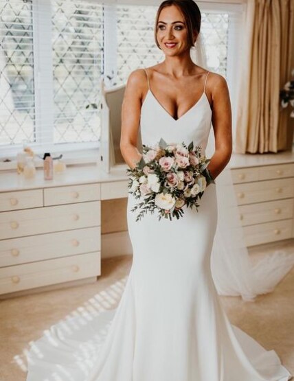 A stunning bride with her beautiful bridal bouquet